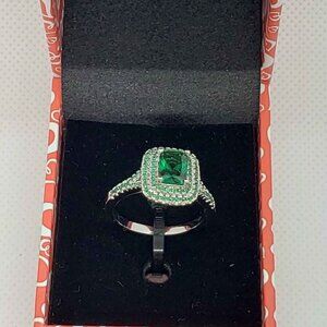 18k White Gold Plated ring with green cubic zirconia stones